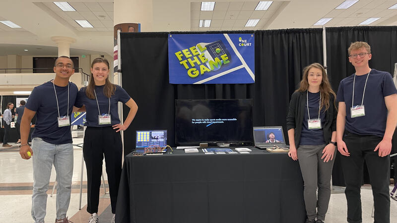 Nonprofit team collaborating around a laptop